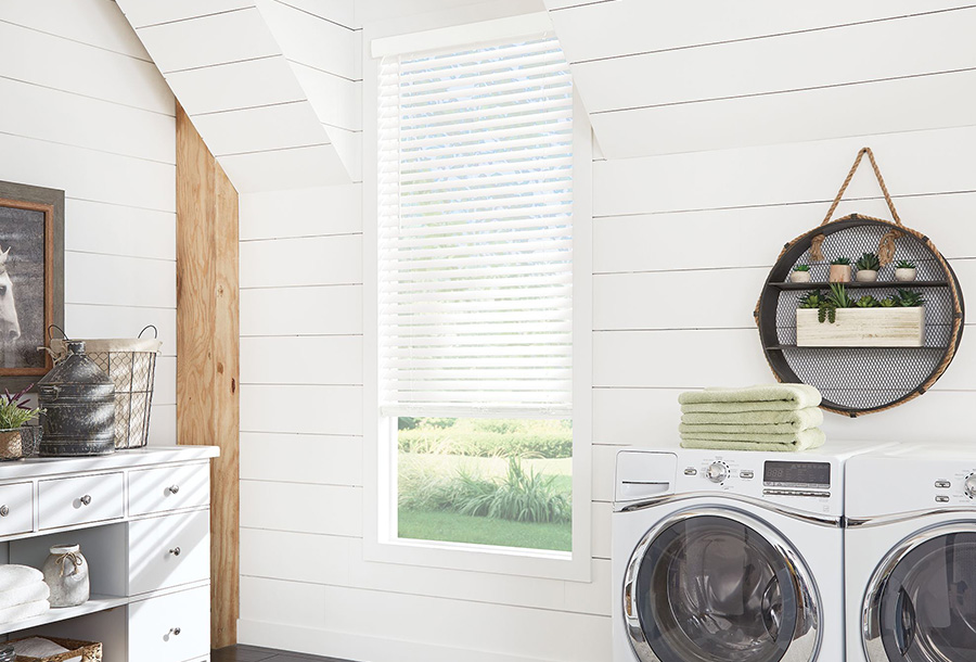 Faux wood window blinds in a laundry room